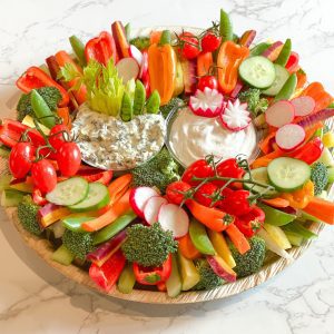 colorful crudites platter with veggies and dip